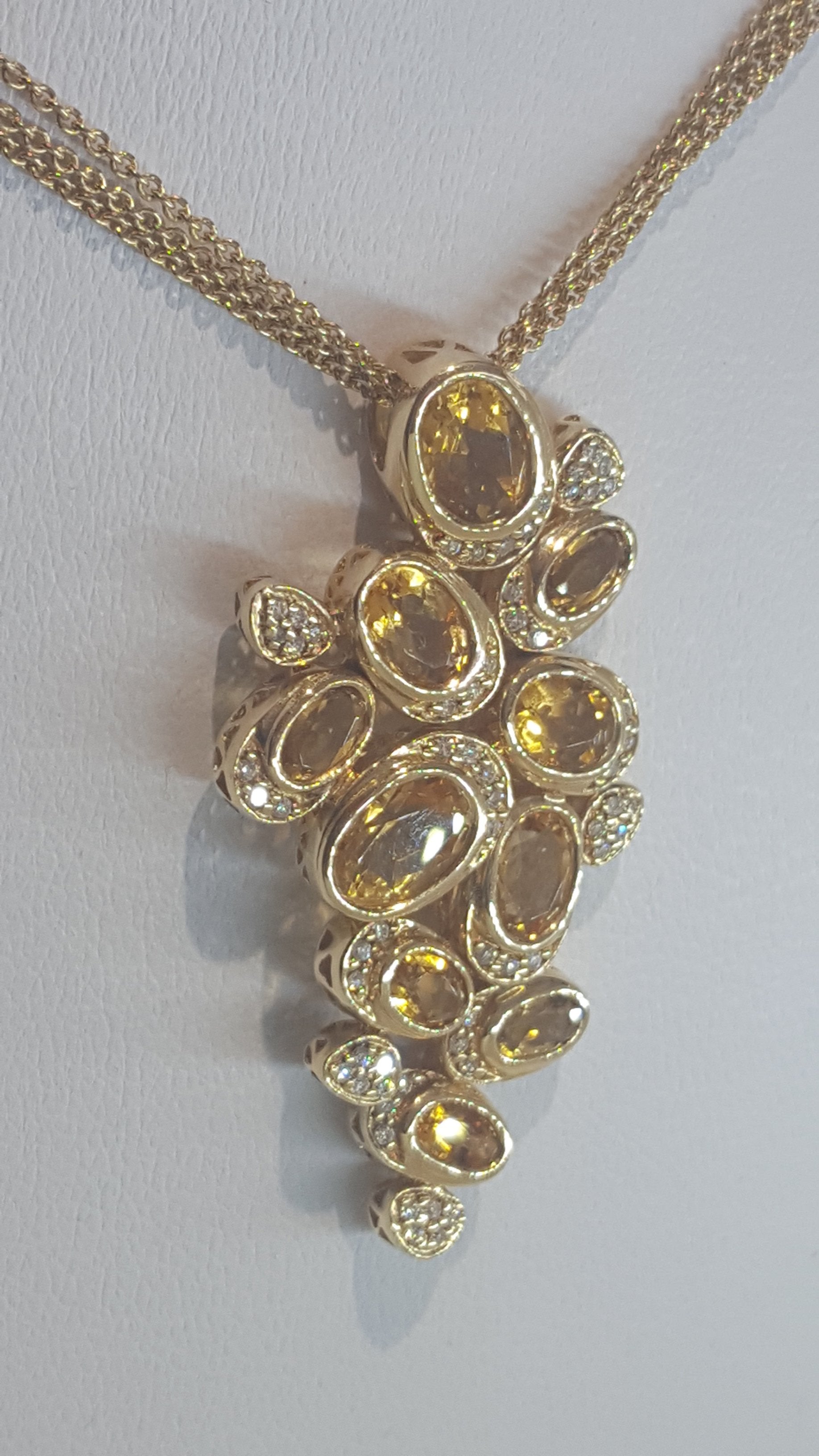 Articulated Topaz and diamond necklace